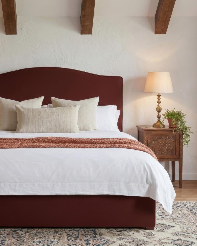 Byron velvet upholstered bed in a warm autumnal bedroom