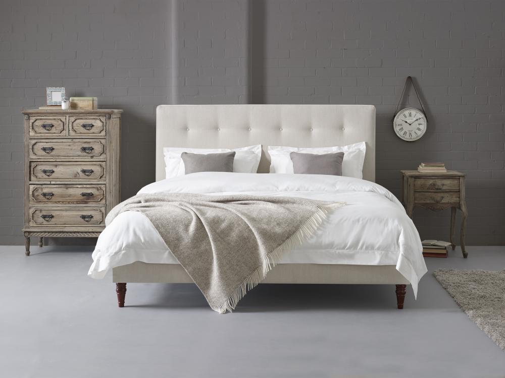 Eliot contemporary upholstered bed fitted neatly into a bedroom